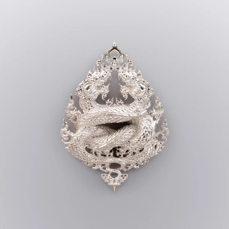 เนื้อเงินพ่นทราย เหรียญพญานาค รุ่นนาคเกี้ยว - Highness Amulet